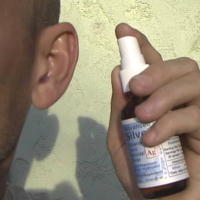 Spray Colloidal Silver in Ear