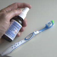 Spray Colloidal Silver on Toothbrush
