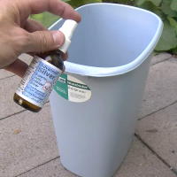 Spray Colloidal Silver in Trash Can